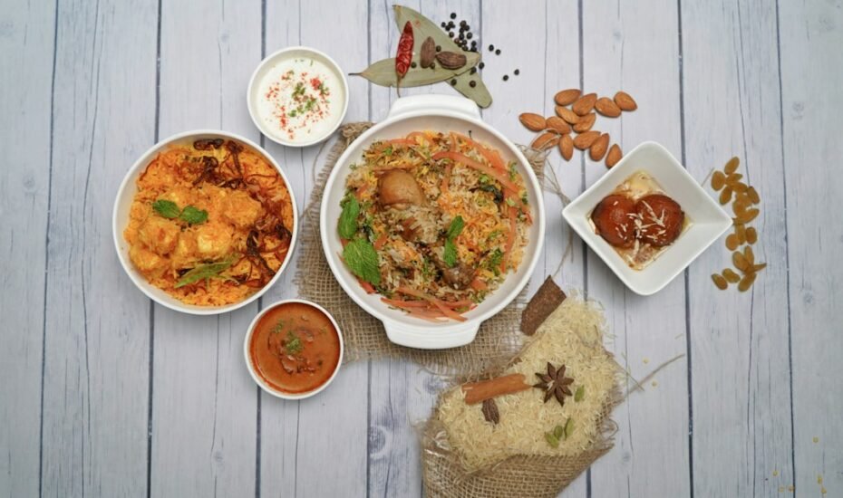 Table of Indian curries, rice and sides served at an Indian restaurant in Amsterdam