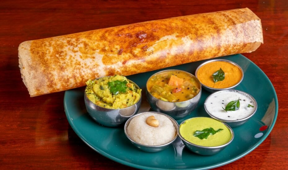 Crispy masala dosa served with coconut chutney and sambar at a South Indian restaurant in Amsterdam