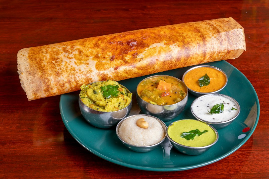 Crispy masala dosa served with coconut chutney and sambar at a South Indian restaurant in Amsterdam